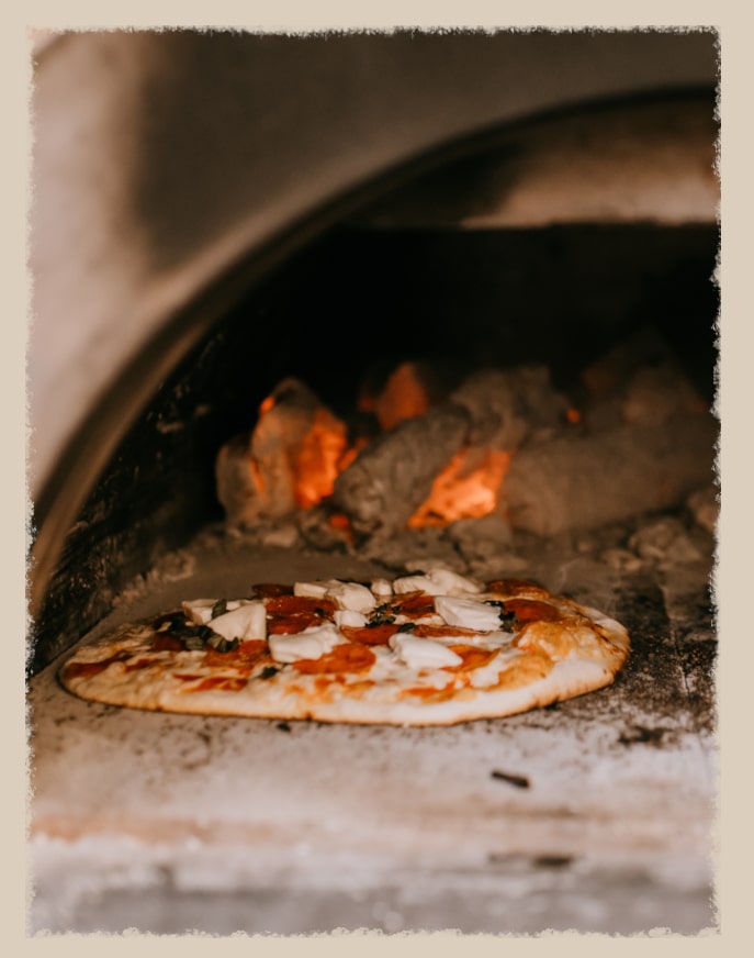 An oven baking a pizza